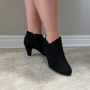 Black booties with a heel.